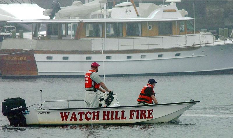 Lt. Brian Holdredge and Fire Police Officer Mike Flanery participate in a water search with the old Marine 100 in 